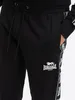 Pánske bežecké nohavice regular fit GRUTNESS Black/White Náhľad obrázku produktu 10