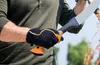 A person wearing gardening gloves is holding a pruning tool. Produktbild-Vorschau