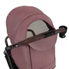 A close-up view of the canopy and handle of a stroller. Produktbild-Vorschau