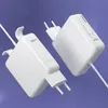 Two white Macbook chargers are shown against a light purple background. Produktbild-Vorschau