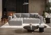 A modern living room with a fireplace, wooden wall paneling, and a large sectional sofa. Produktbild-Vorschau