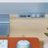 A Satechi USB-C clamp hub is attached to the base of an iMac. Produktbild-Vorschau