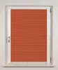 A close-up view of an orange pleated blind covering a window. Produktbild-Vorschau