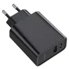 A black USB charger with two ports and foldable prongs. Podgląd zdjęcia produktu
