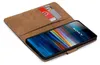 A brown book-style phone case with slots for cards, holding a smartphone with a colorful abstract wallpaper. Anteprima dell’immagine prodotto