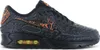 A side view of a black Nike Air Max 90 sneaker with orange accents. Anteprima dell’immagine prodotto