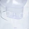 A close-up view of the bottom section of a clear plastic water filter pitcher, showing two small, white, V-shaped markings on the exterior of the pitcher's base. Náhľad obrázku produktu