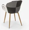 A patchwork chair with wooden legs against a white background. Voir les images du produit