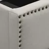 Close-up view of the upholstered edge of a bed frame, showing decorative nailhead trim. Produktbild-Vorschau