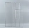 Three stainless steel grill racks of different sizes are displayed against a light gray background. Náhled obrázku produktu