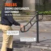 A man is using a metal handrail on outdoor stairs. Náhled obrázku produktu