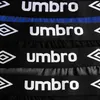 A close-up view of multiple black boxer briefs with the Umbro logo and diamond symbol on the waistband. Náhľad obrázku produktu