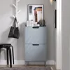 A hallway with a shoe cabinet, a stool, and a coat rack. Produktbild-Vorschau