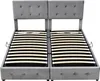 A grey upholstered bed frame with two headboards and slatted bases is shown against a white background. Náhľad obrázku produktu