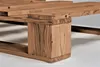 A close-up view of a wooden bed frame, focusing on the construction and texture of the wood. Produktbild-Vorschau