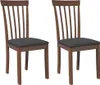 Two wooden dining chairs with dark gray cushions are shown against a white background.