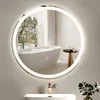 A modern bathroom with a freestanding bathtub, a sink with a gold faucet, and a round LED mirror. Anteprima dell’immagine prodotto