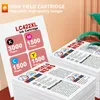A close-up of printer ink cartridges and stacks of printed paper. Produktbild-Vorschau