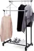 A double-tiered garment rack holding clothes and shoes. Produktbild-Vorschau
