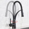 A black kitchen faucet with a flexible neck is shown against a white brick-like background. Produktbild-Vorschau