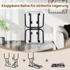 A folded dog grooming table is shown in a room with a plant and a couch. Below, a diagram illustrates how to fold the table's legs. Anteprima dell’immagine prodotto