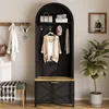 An entryway with a black arched hall tree, a wooden bench with a green cushion and a plaid throw, and a potted plant. Produktbild-Vorschau