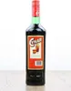 A bottle of Cynar liqueur is shown against a white background, standing on a wooden surface. Produktbild-Vorschau