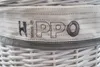 Close-up of the embroidered text 'HIPPO' on a white fabric band around a white wicker basket. Náhľad obrázku produktu