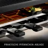 Close-up view of a raclette grill with food and accessories. Náhľad obrázku produktu