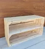 A wooden shelf unit made from crates, placed on a wooden floor against a wooden wall. Náhled obrázku produktu
