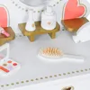 A close-up view of a toy vanity set with makeup accessories. Podgląd zdjęcia produktu