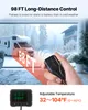 A hand holding a remote control for a diesel heater, with a motorhome in the background during winter. Produktbild-Vorschau