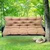 A taupe colored swing cushion on a swing set in a garden setting. Náhled obrázku produktu