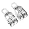 Two stainless steel double pulleys are shown against a white background. Voir les images du produit