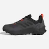 A side view of a black and gray Adidas Terrex AX4 hiking shoe with orange accents. Anteprima dell’immagine prodotto