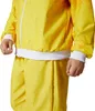 Close-up of a person wearing a yellow tracksuit. Produktbild-Vorschau