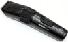 A close-up studio shot of a black and gray hair and beard trimmer against a white background. Anteprima dell’immagine prodotto