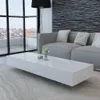A modern living room with a grey sofa, a black floor lamp, and a white coffee table.