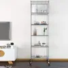 A tall, silver, five-tier shelving unit with various decorative items on each shelf, placed against a white wall in a room with a television and a cabinet. Voir les images du produit