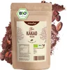 A brown paper bag of cocoa powder with cocoa beans and powder scattered around it. Produktbild-Vorschau