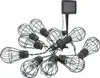 A string of solar-powered LED lights with cage-like bulb covers and a solar panel on a stake. Náhled obrázku produktu