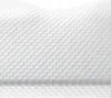 A close-up view of a white, textured mattress or pillow surface with a hexagonal pattern. Náhled obrázku produktu