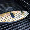 A fish being grilled on a barbecue. Produktbild-Vorschau