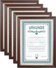 A stack of framed certificates or documents, with one frame in the foreground showing the word 'URKUNDE'. Produktbild-Vorschau