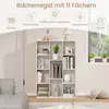 A white bookshelf with various items on its shelves, placed in a room with a sofa and a window. Produktbild-Vorschau