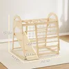A wooden indoor playground structure for children, with dimensions indicated by yellow lines and text. Podgląd zdjęcia produktu