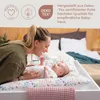 A mother interacting with her baby on a changing table. Podgląd zdjęcia produktu