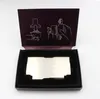 An open box containing a silver metal card, with instructional diagrams on the inside lid. Produktbild-Vorschau