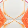 A close-up view of a soccer ball with hexagonal panels and orange and pink accents. Produktbild-Vorschau