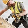 A construction worker using a DeWALT drill on a wooden surface. Anteprima dell’immagine prodotto